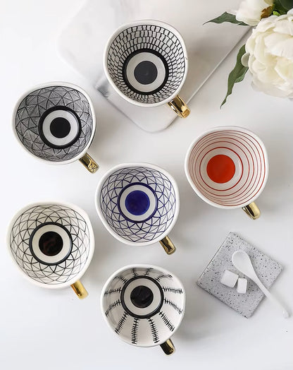 Colorful Ceramic Cups With Artistic Patterns Inside Each Mug With Gold Handles